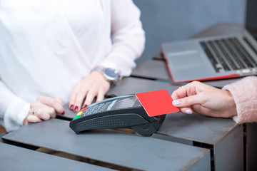 Paying with credit card and banking terminal at the store