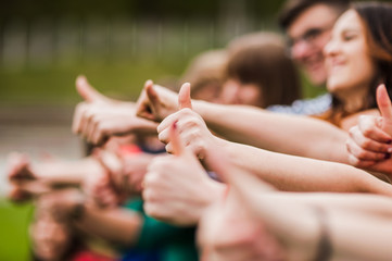 Hands of young people in the nature