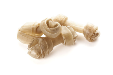 Small cowhide dog bones isolated on white