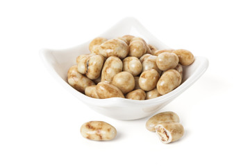 Candied Pecan nuts in bowl isolated