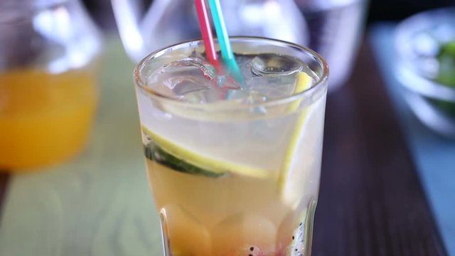 light color summer non-alcoholic cocktail with tube