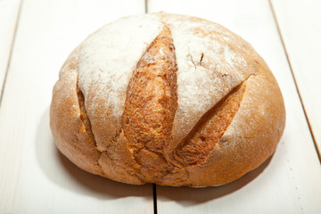 Bread on a white wooden background