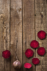 sliced beetroot on slate and wooden counter top background