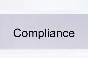 Office folder with the label compliance on white background