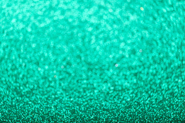 Fototapeta premium Defocused green glitter background