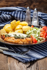 Fried chicken fillet with spinach and cheese.