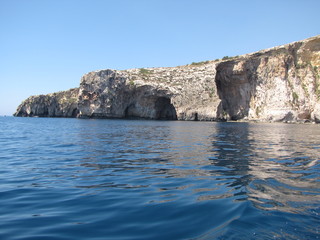 Fototapeta na wymiar A Rock on the Water in the coasts of Malta