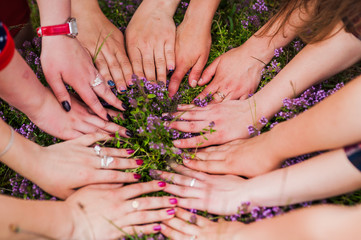 Fototapeta premium Hands of young people in the nature