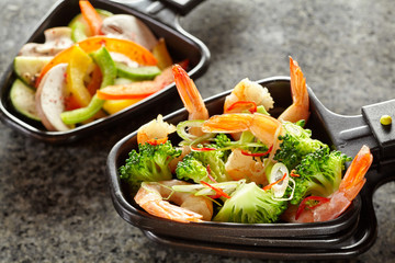 Fresh prawn or shrimp tails with broccoli
