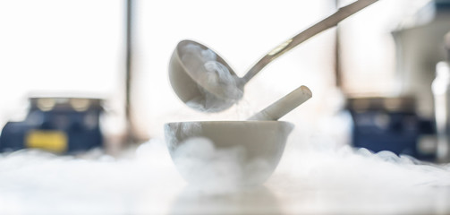 Laboratory experiment with liquid nitrogen in laboratory mortar