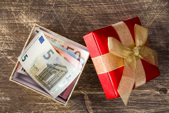 Euro banknotes inside the gift box