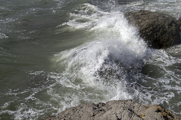 Strong surf breaking on coastal cliffs. Crimea.
