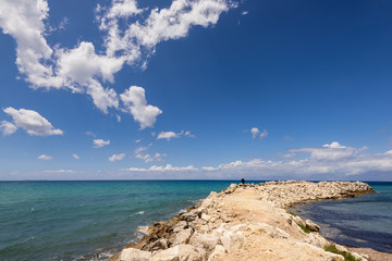 Fototapeta na wymiar Seascape with amazing clouds on the sky near Acharawi village, Corfu, Greece.