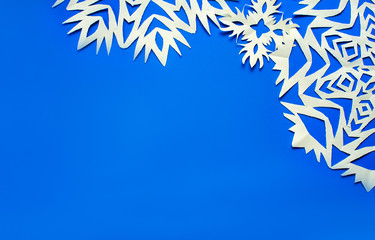 Fototapeta na wymiar Christmas snowflakes cut from paper