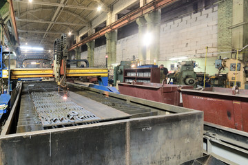 Oxygen torch cuts steel sheet.