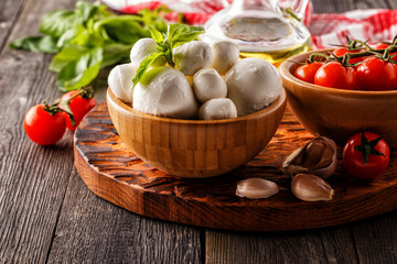 Ingredients for cooking - mozzarella cheese, tomatoes, basil, ga
