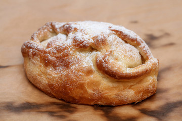 Freshly sweet bun with sugar powder, selective focus
