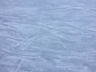 Background of light ice in skate scratches, abstract texture surface