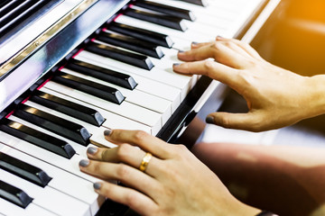 Obraz premium women playing piano. soft focus