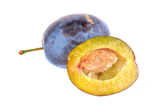 Cut plum on a white background