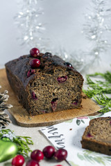 Banana bread with cranberries and almond. Christmas cake. Christmas decoration. White background.