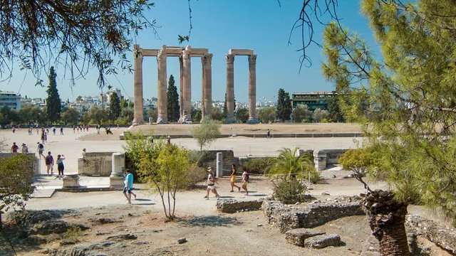 Athens Greece Temple of Olympian Zeus with Sightseeing Tourists Visiting the Ancient Historical Greek Landmark on a Hot and Sunny Summer Season Day