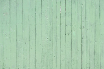 Texture of colored green wooden fence