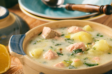 Potato soup with salmon, leek, sour cream and parsley.