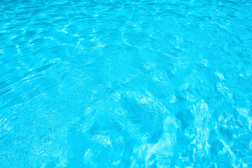 Blue and brigth ripple water and surface in swimming pool