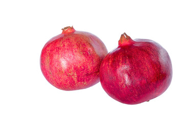 Two ripe pomegranate isolated on a white background.