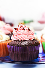 Chocolate and strawberry cream cupcake.