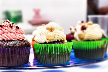 Cupcakes on a blue stand.
