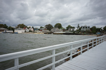 Coastal houses of City Island from white wooden pier - 130096198