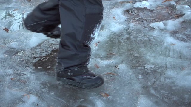 Boy running on thin ice, slow motion
