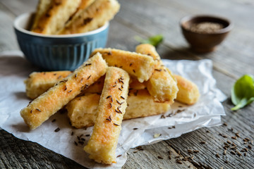 Baked salty breadsticks sprinkled with cumin seeds