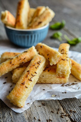 Baked salty breadsticks sprinkled with cumin seeds