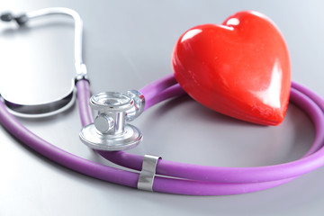 Stethoscope and medical equipment on a light background