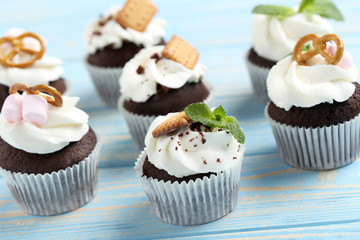 Chocolate cupcakes on a blue wooden table