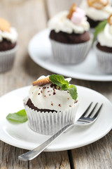Chocolate cupcakes on a grey wooden table