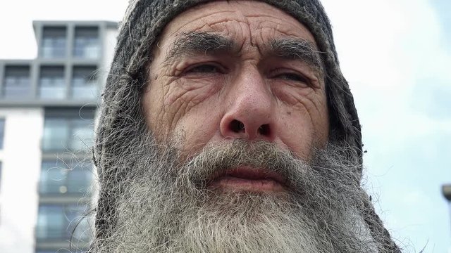 face of a real homeless man living in the streets of an England city 