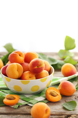 Ripe apricots fruit on grey wooden table
