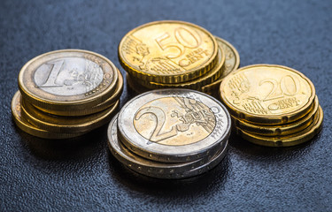 Euro coins. One Euro coin on the foreground.