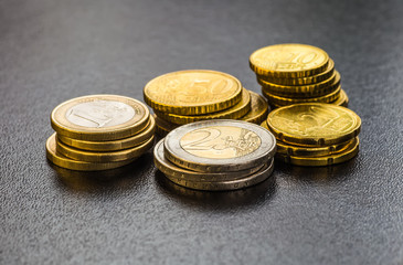 Euro coins. One Euro coin on the foreground.