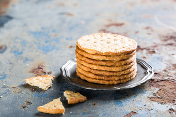 Homemade shortbread cookies with quinoa on old metal background with copy space.