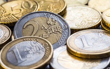 Euro coins. One Euro coin on the foreground.