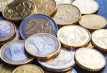 Euro coins. One Euro coin on the foreground.