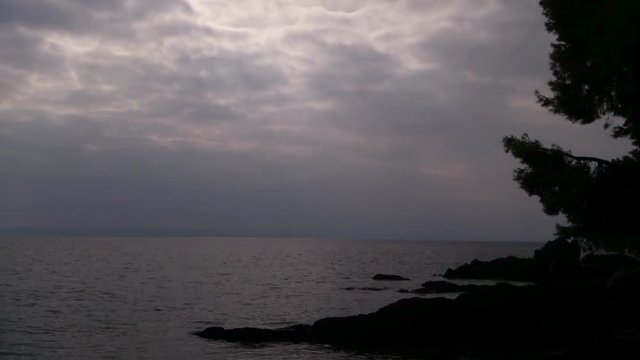 Dark cloudy sky over the sea at Sithonia, Chalkidiki, Greece - Time Lapse