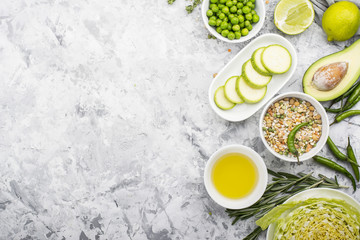 Fresh green vegetables and herbs. Ingredients for the seasonal dishes. The concept of organic natural food. Top view