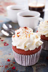 Delicious red velvet cupcakes on rusty old metal background. Valentines Day food.