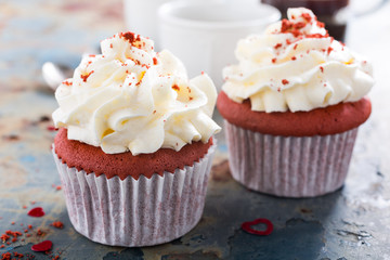 Delicious red velvet cupcakes on rusty old metal background. Valentines Day food.